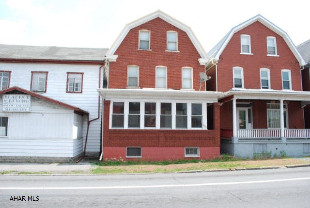 Nicely Remodeled Kitchen, Finished Attic with Laminate Flooring, New Roof, Hot Water Heater, and Carpeting