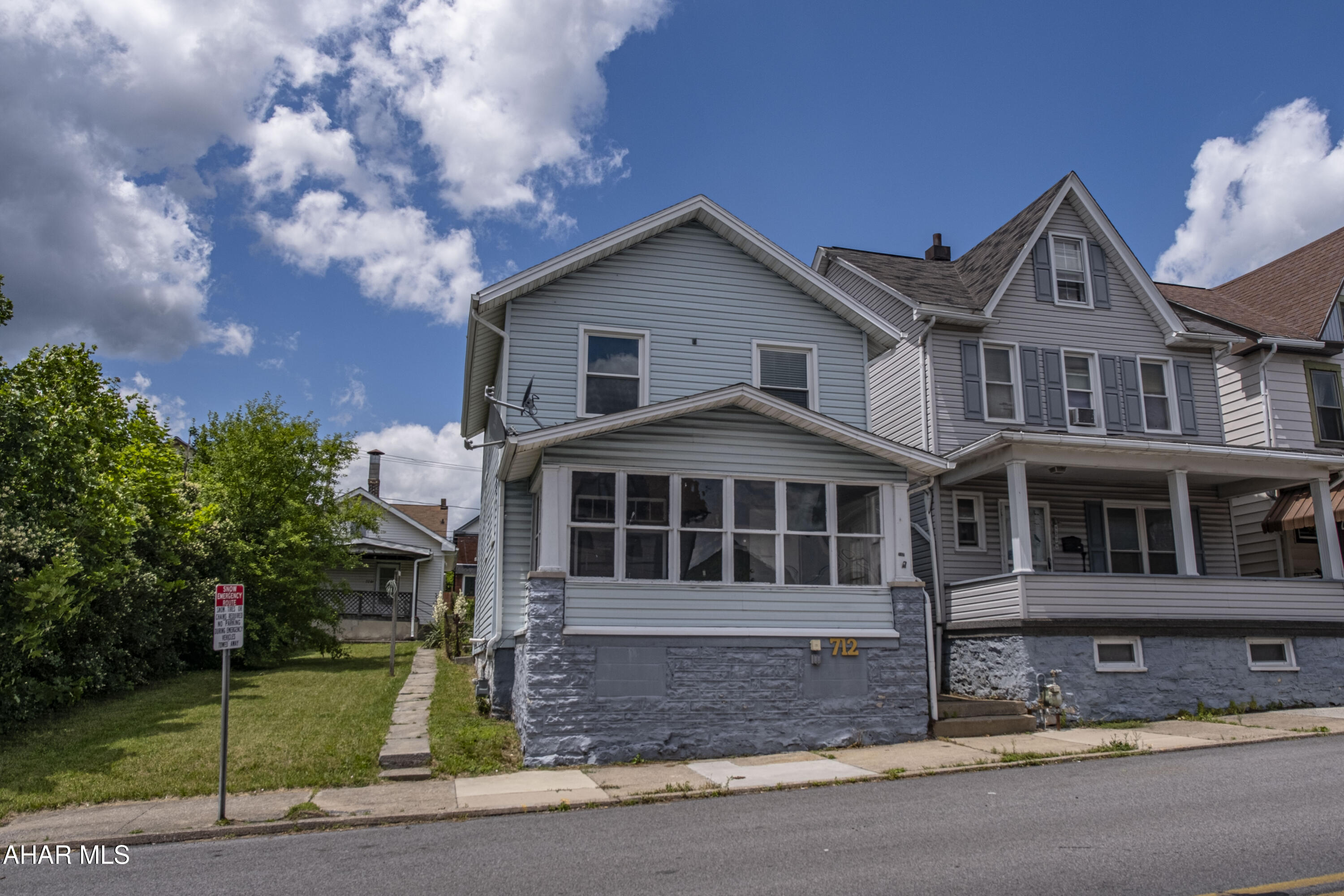 This updated two-story home features an enclosed front porch that leads into a main floor with a living room, dining room, kitchen, and laundry room. Upstairs, the second floor contains three bedrooms and one full bathroom. With its practical layout and recent updates, the home is completely move-in ready.