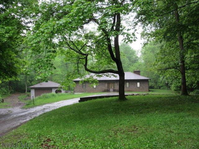Are you looking for privacy? Look no further! Check out this ranch home on 4 acres of ground, open living area, large bedrooms, some tlc will make this a great home