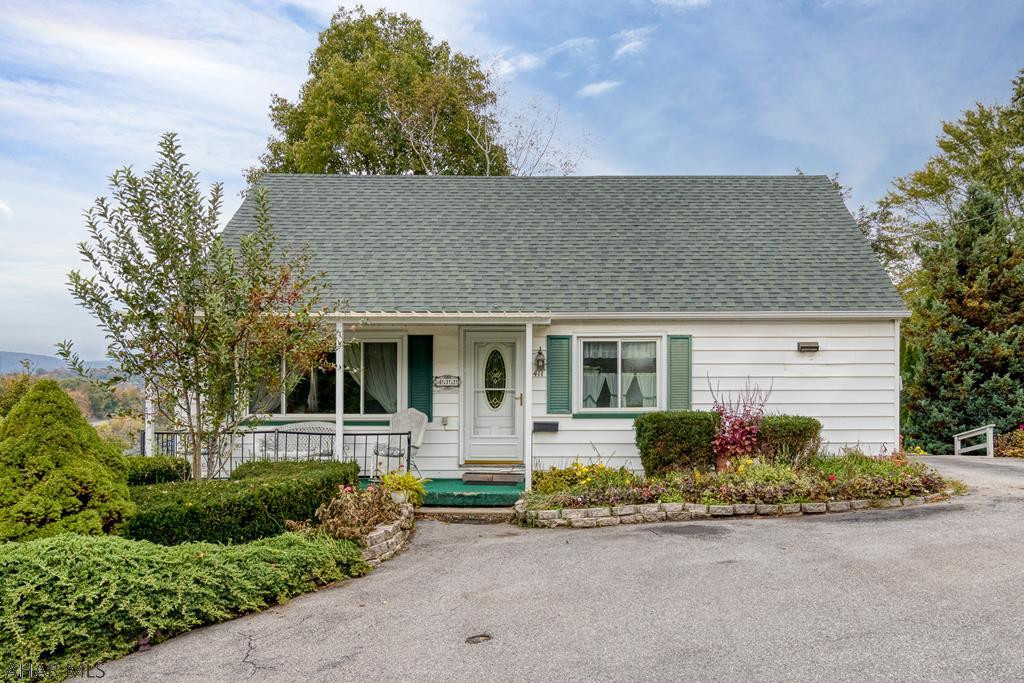 Some updates in 2013, this 3 bedroom, 1.5 story home has many desirable ammenities! Lot is .31 acre with deck in back, Sun Room is vented for heat/AC, Full bedroom 1st floor, large Living Room, eat in kitchen, 2 bedrooms and full bath 2nd floor, covered front porch, basement has some finishes, 1.5 bath with walk out, off street parking for multiple cars. See pictures to appreciate!