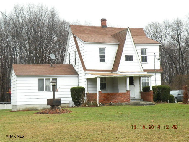 Cape Cod -Northern Cambria school district.  3 BR, 1 bath, large eat-in kit, LR, DR. Oil & coal hot water heat. 2.4 acres.  3 car garage, barn, above ground pool. Nice level lot. Appliances all included. Well & septic.
