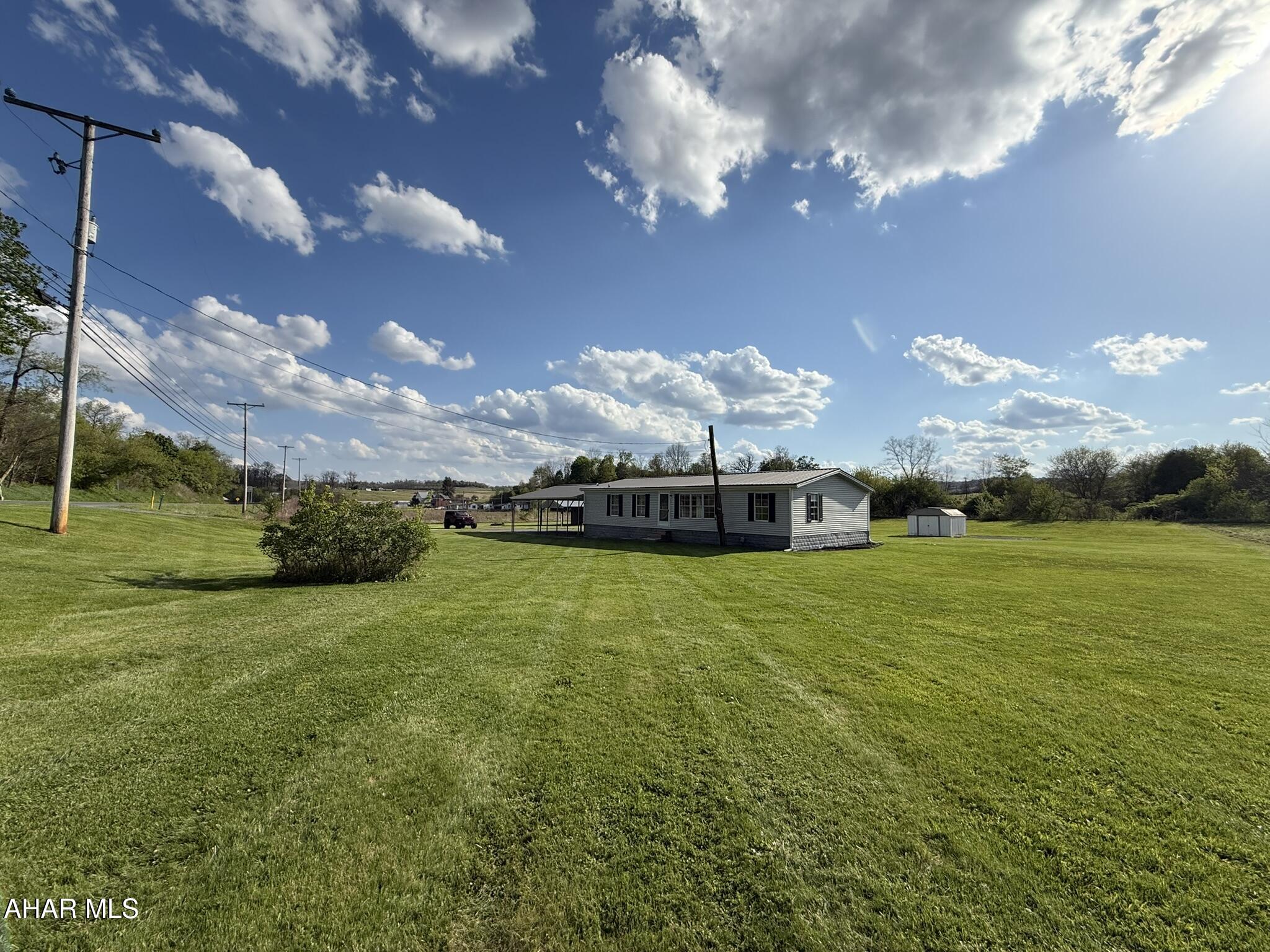 Enjoy the space, privacy, and setting that make Warriors Mark such a desirable place to call home. Situated on 1.4(+/-) acres of owned ground, this 3-bedroom, 2-bath home offers comfortable living in a beautiful rural location while still providing convenient access to nearby amenities.

Inside, the home features a spacious layout with a large living room, central air conditioning, and numerous remodeling improvements already completed. The open feel of the home creates a comfortable flow throughout, with plenty of natural light and flexible living space.

Outside, the property truly shines with wide open yard space, room to enjoy the outdoors, and an included swimming pool for summer enjoyment. The mostly flat land offers endless potential for outdoor entertaining, recreation, gardening, or simply enjoying the peaceful surroundings.

Properties with acreage in Warriors Mark are hard to come by, especially with this combination of space, setting, and value. Don't miss the opportunity to own a property in one of the area's most sought-after rural communities.