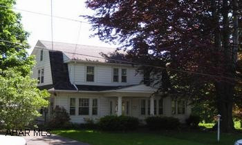 See comments. Truly charming Dutch colonial on extra large lot offers you plenty of room and much convenience - everything within walking distance!!  9' ceilings, original woodwork, hardwood floors, original dining room and living room chandelier, woodburning fireplace in livingroom, sweet all season room off living room.  Half bath first floor.  All 3 bedrooms up along with a full bath.  Roof replaced in 2005, chimney flu inspected 2005, pull down attic access - attic is floored, updated electrical.  Plenty of perennials, stone patio, old fish concrete fish pond.  Partially finished and walk-out basement.  Smart buy - this is a home that anyone would want!