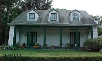 Charming home in wonderful location featuring huge living room w/ hardwood floors & stone fireplace.  Hardwood floors thru 3 bedrooms & computer room on 2nd floor .  All situated on 75x120 lot