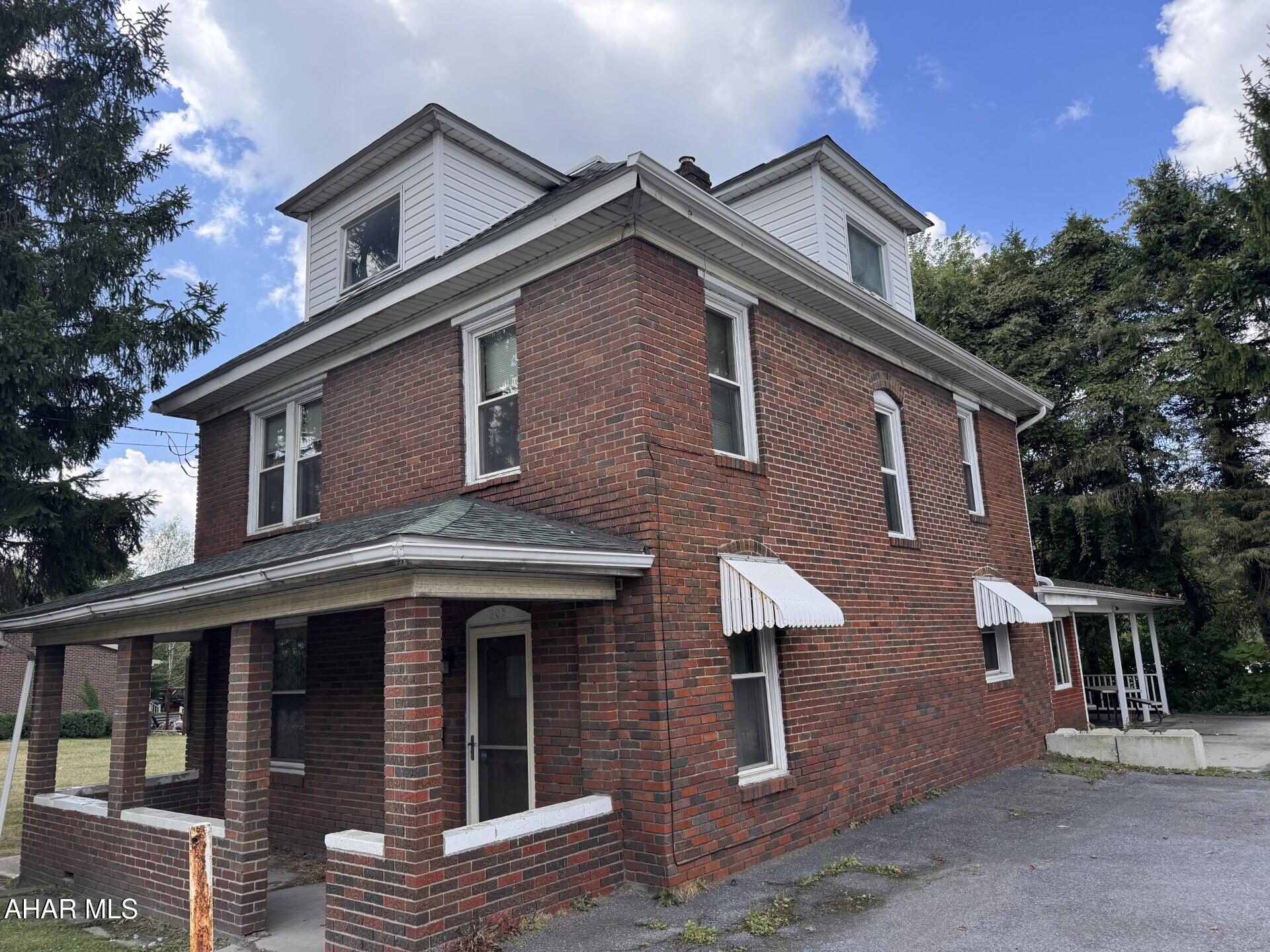 Two story brick home with 3-4 bedrooms.  Spacious kitchen , formal DR, LR, 1st floor laundry & family room with wood fireplace.  Oil HW cast iron & radiator heat.  Side porch & patio.  All appliances included.