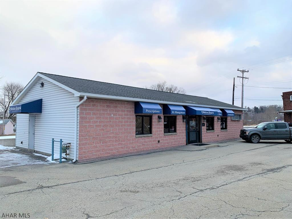 One-story office building with a corner lot. High traffic and visibility. Building contained three offices, two restrooms, reception area, kitchen and a large open work area with office modules. Gas FA heat, central air conditioning, 200-amp electric with back up generator, and security system. Macadam parking lot with approximately 15 vehicles spaces. Comp purposes only.