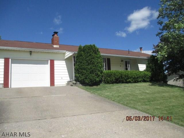 Really Nice AND WELL KEPT RANCHER WITH 1/3 ACRE IN A VERY NICE RESIDENTIAL NEIGHBORHOOD.  House has Electric heat with Heat Pump and baseboard storage heat.Beautiful stone fireplace in the living room and newer Pergo Flooring.  Newer refrigerator and sink in Kitchen, double oven.Central air throughout. Some planeling ,carpet, pergo  and ceiling tile.House is vinyl sided, Roof age 1993.  A 3 season sunroom in the rear and nice patio to enjoy the nature. Finished family room in the basement with New Kitchen cabinets