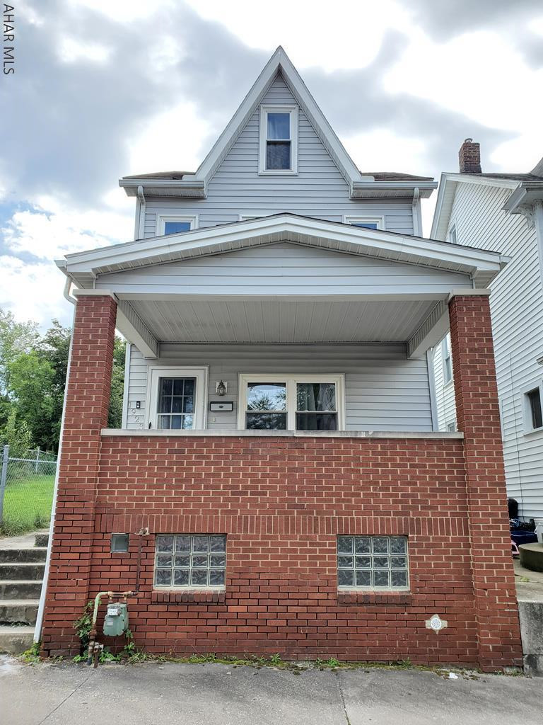 Check out this adorable, move-in ready home!  Sitting on top of a hill with a beautiful view and double lot, this home is ready for it's new owners.  Enjoy your time outdoors on the covered front porch, or on the back patio of the spacious lot.  The main floor houses a Living Room, Dining Room, Kitchen and Mud room, while the 2nd floor has 3 spacious bedrooms and a full bath.  The attic is finished for the option of a 4th Bedroom or bonus room.  There is also the possibility of off street parking in the rear! Don't miss your opportunity to own this affordable home. Call today for your private tour.
