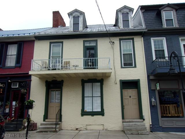 HISTORIC DOWNTOWN BEDFORD COMMERCIAL/RESIDENTIAL PROPERTY.   Circa 1795 home & workshop of renown clock & watchmaker, Jacob Diehl (1776-1858). The currently vacant first floor of this Federal style building was recently renovated and used for specialty retail.  Large, 2 level owner's family apartment includes eat-in kitchen, living room, 2 baths, 3 bedrooms, laundry area as well as 2nd floor balcony overlooking Juliana St.  Apartment could easily be split into 2 smaller units as it was previously.  One unit could be used as a monthy rental  or an airbnb for extra income.  Private residential entrance in front.  Private parking in rear. Convenient to downtown amenities and the Bedford Springs as well as a short distance to I-99 and PA Turnpike. PRIME RETAIL LOCATION