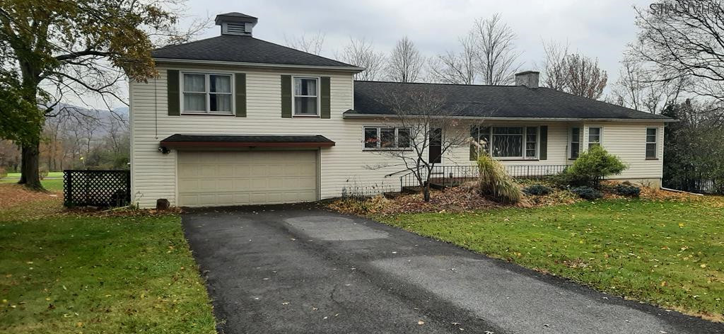 1 1/2 Story Home In Hollidaysburg with a awesome view .. 3 bedroom ( one bd on 1st flr ) , 2 baths, hard wood flrs,  gas fire place, heated sun room, laundry on 1st flr , garage  all sitting on .5 of  a acre.. Dont Delay Set Up A Showing today