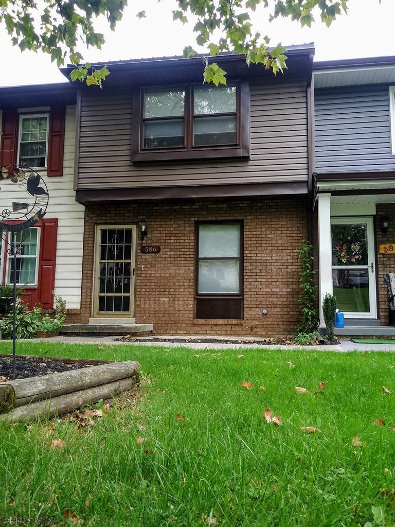 Perfect starter home or rental in Penn Farms townhouses.  New roof, siding, and carpeting on stairs and second floor done in 2020.  2 bedrooms, Eat in Kitchen with balcony, 1 full bath and 2 half baths.  Full basement down to basics presents potential for a family room or 3rd bedroom with door to backyard.  Greenery in the backyard gives some privacy without being an end unit.  Schedule your showing today!  Priced to sell!