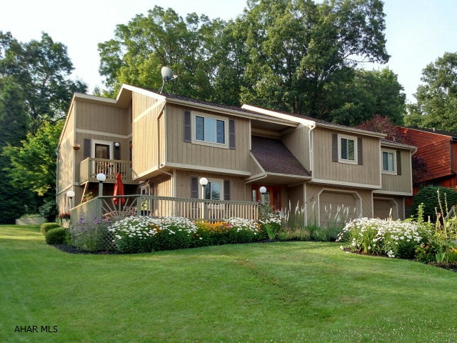 This amazing Cricket Knoll home is one of a kind. Just move in and enjoy the indoor and outdoor living spaces. 13 ft cathedral ceilings in the open floor plan, oak and bamboo flooring throughout. Enjoy mountain views in the front, and the private backyard from the sunroom in the back. Master bedroom has a walk-in closet and a sliding door to the back deck and the kitchen has a deck for grill or table for two. Two zones for heat and central air. Huge 2 car garage. Unique loft and large attic on the third floor. There is room for expansion on the first floor under the sunroom. A perfect home for entertaining or relaxing. -- Treehouse can be removed before closing.
