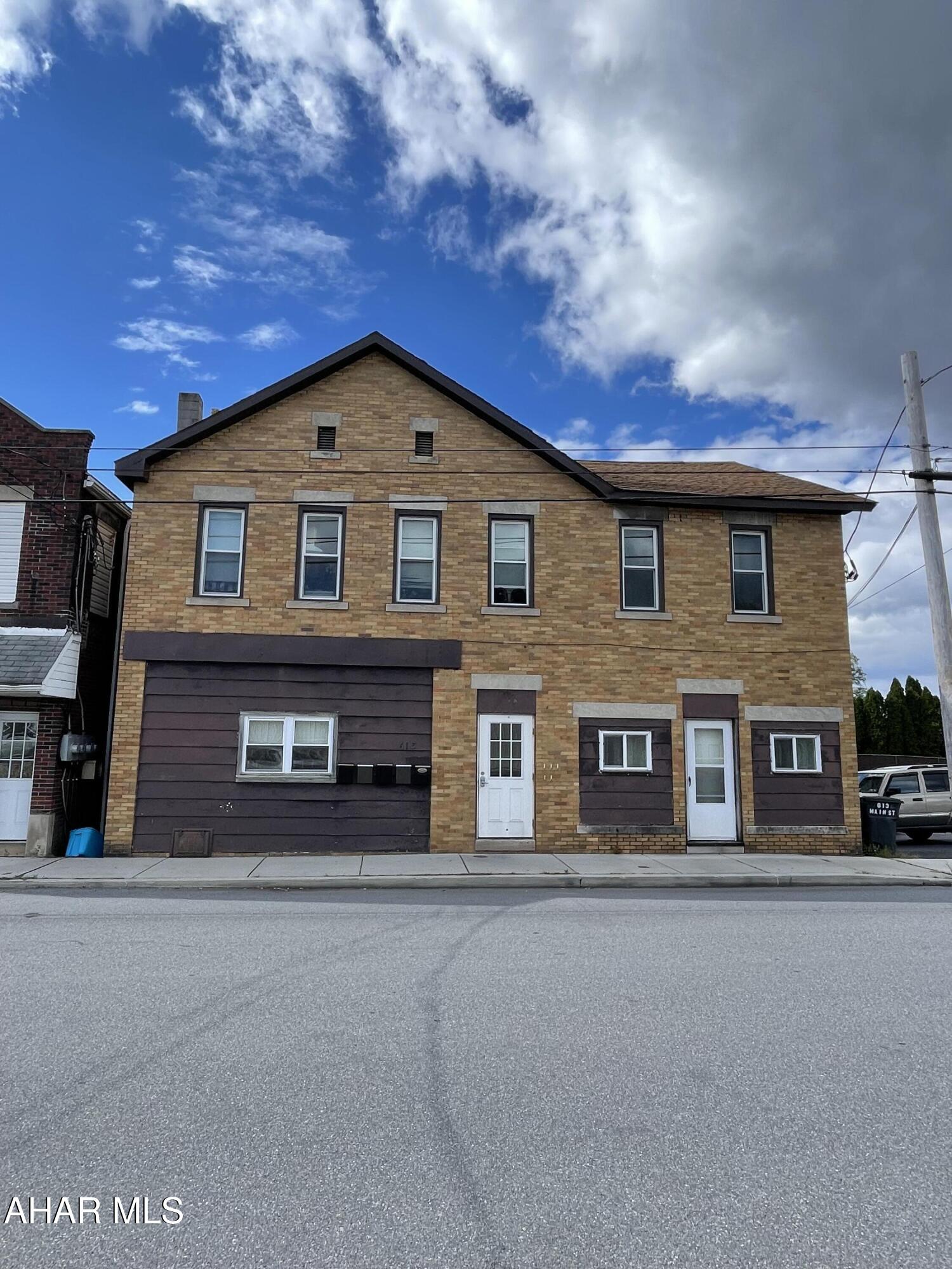 Need to spend tax money by the end of the year.... Add this one to your portfolio!  5 unit apartment building with an additional vacant lot intended for overflow parking for the tenants.  Tenants pay electric.  Water sewer garbage included in rent. One long term tenant has been in the building since before current owner purchased, and it is the only unit not renovated.  Fully occupied.