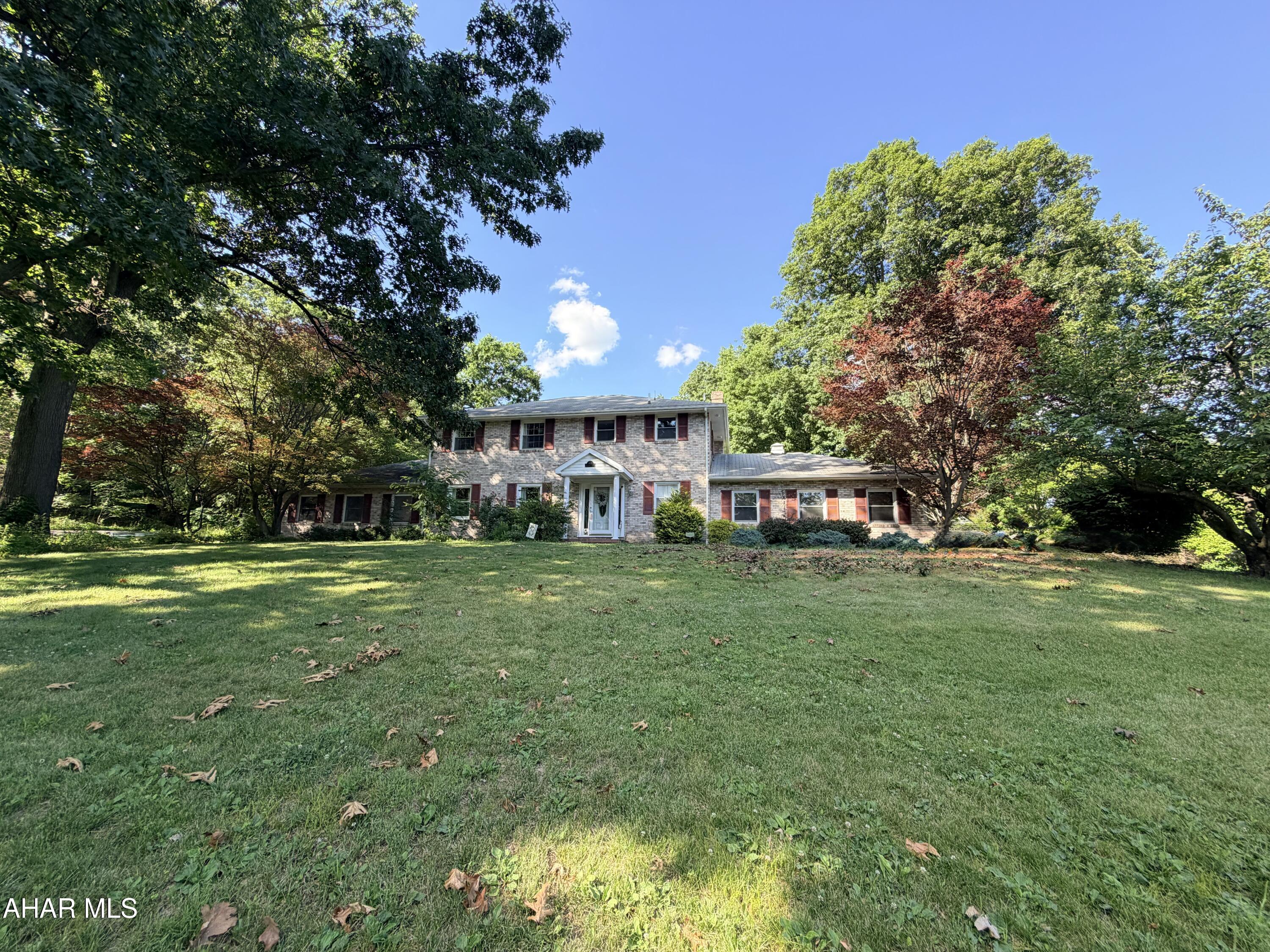 708 Beaumont drive has everything you could ever ask for in a home!
The stately exterior is the first thing to catch the eye. Moving past the elegant presentation of the home itself, you'll find the outdoor space has so much to offer. The large front yard is an ideal template to create beautiful gardens and transform the landscape into your own private retreat. Just behind the home is a fully fenced backyard with a fully upgraded  in-ground pool. We can't forget to mention the poolside tiki bar either! Paired with a two car integral garage and large driveway, you won't need to worry about parking either. With so much versatility in the outdoor accommodation, every gathering is sure to feel special.
The home interior is equally as rewarding. The first floor offers a formal dining room, a HUGE living room, and a large kitchen open to the family room. The family room is the perfect place to settle down after a meal and enjoy a beautiful fireplace! Gorgeous hardwood floors in the dining, living room, and family room add a welcoming feeling wherever you decide to spend your time. On the first floor you'll also find one of the two Bedroom suites with built-in closets, dressers, a walk in closet, and full private bathroom. Sliding doors to the poolside patio from this bedroom are just the cherry on top! Upstairs you will find two additional large bedrooms, and the second bedroom suite with private bath. All three upstairs bedrooms are accented by hardwood floors, and impressive size. If you have been struggling with small room sizes and just can't seem to find a house on the market with actual large rooms, these will not disappoint.
As if the almost 3,000 square feet of above ground living space wasn't enough...a finished basement gives you even more!  Great for a workout area, home office, or just extra storage. How you choose to utilize it is limited only by the imagination. 
With features like central air, inground pool, large lot, 4 bedrooms, 4 bathrooms, and massive room sizes...the only thing missing from this home is you! Be sure to set up a private tour or call your agent to check this one out. Your home is waiting for you!