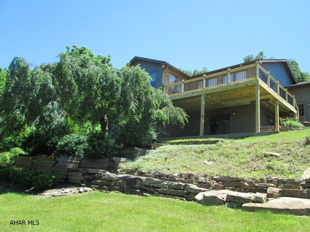 Custom built one story in a very private setting. This immaculate home features some of the best views in Blair County. The first floor master bedroom suite has all the upgrades you can expect, plus its own private deck with a view. The gourmet island kitchen boasts corian tops & stainless steel appliances. Convenient first floor laundry room complete with tile floors. Lower level has 2 bedroom suites and each has WIC and a bath. Current office in lower level could be utilized as a bedroom.