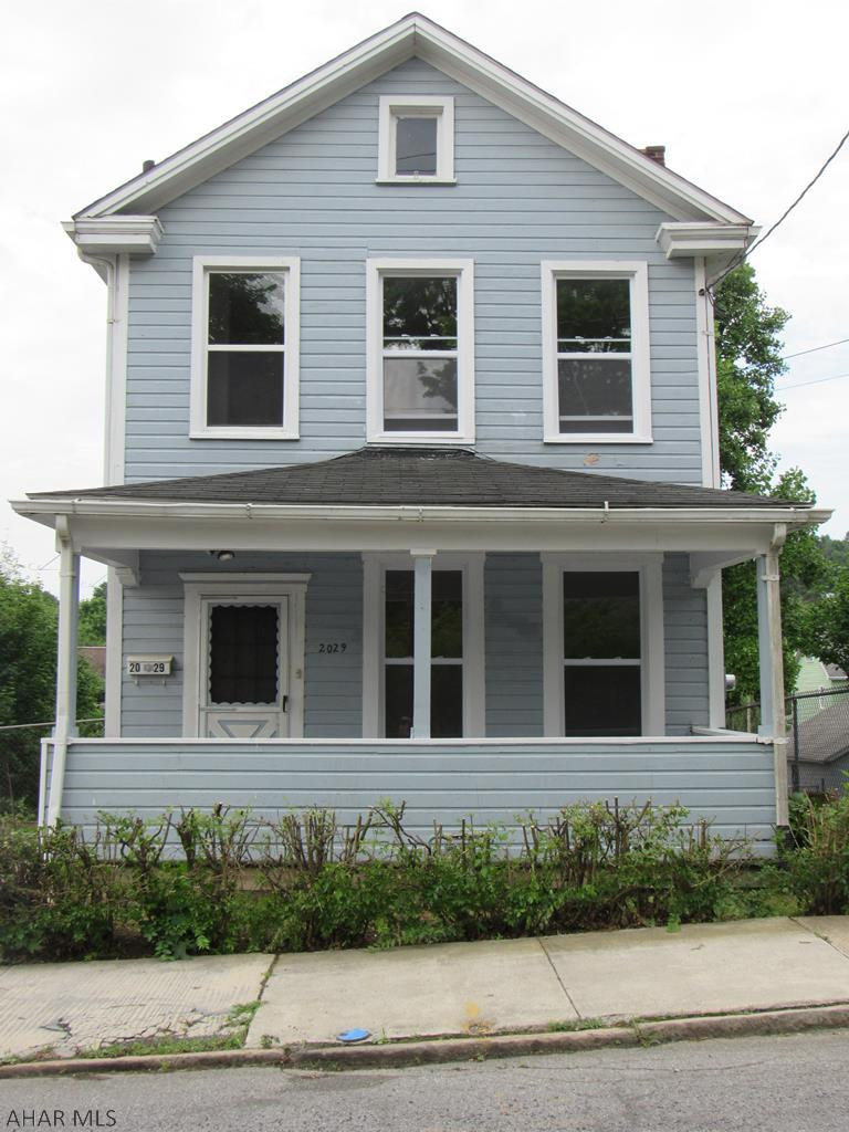 This house is priced right to sell fast! It is on a double lot and is move in ready for the new home owner or the investor that can start earning rental income immediately!  New carpet through out, laminate flooring in foyer, and newer windows provides lots of natural light. Great covered front and rear porch. Plenty of off street parking. Access from the alley behind enables you to add a garage or add more parking. Investors call for a showing today, you will be glad you did!