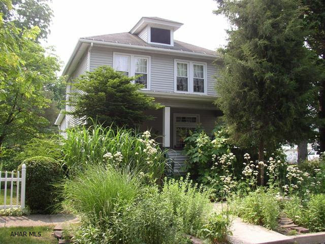 East End. Serene setting in a great neighborhood. This 3 bedroom offers newer windows, siding & hot water heat system. The sunroom and deck are a quiet oasis to unwind. Sale includes kitchen appliances. Interior walls to be fixed prior to settlement or a credit for such work can be applied.  A must see in this price range.