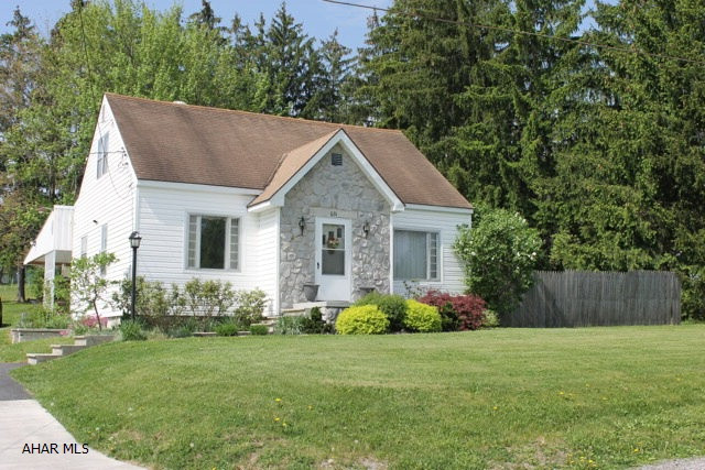 Country setting on over 1/2 acre in Logan Twp. with low taxes. Cozy cape cod with 4 bedrooms, 1 1/2 baths and hardwood floors throughout. Large covered patio that could be used as a carport in the winter months. Nicely landscaped yard is perfect for outdoor entertaining. Conviently located to elementary school and shopping.