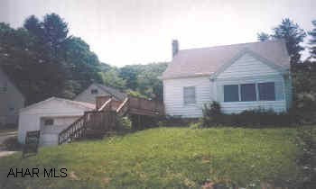 Cute 2 Bedroom Cape on almost an acre with horse barn & fencing
