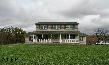 House is plumbed for Central Air.  Prepped for Central vac.  2 separate attics for storage.  Plumbed for bath in basement. Newly built 2 Story Home in the country located on 2.68 acres.  Large 1st floor master suite.  Heated floor in master bath.  Family room with brick fireplace.  Oak kitchen.  1st floor laundry.  3 large bedrooms on second floor plus den/office.  Tons of storage space.  5 zone heating, very efficient system.  Both full baths have private toilet area - nice feature.  Beautiful hardwood floors.  Much, much more.  All of this located in a Beautiful Counry Setting!  Private!  You've got to see this house!