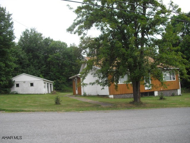 Totally updated ranch home, large detached 3 car garage. 1 acre, great setting.