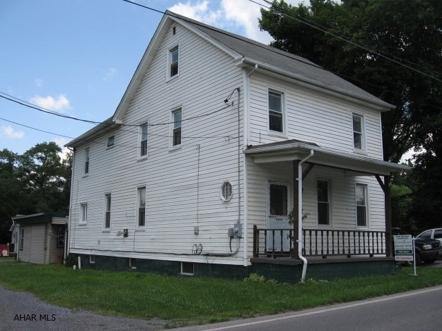 Spacious home with character! First floor has living room w/hardwood floor and shadowbox ceiling; large eat-in kitchen with wainscot, pellet stove, new vinyl tile, lots of cabinets; full bath w/laundry; family room at back w/full wall of wood built-in closets and drawers.  This home has lots of storage areas!! 2nd floor has a front bedroom w/access to the finished room on 3rd floor; two more bedrooms; full bath. Hallway has wood ceiling, wainscot, linen closet & 2nd large closet. There's off street parking for 2-3; 14x6 front porch; side porch off the kitchen with access to the fenced-in yard; 24x12 carport; 24x24 garage w/one sliding garage door and workshop/storage on the left. Home was purchased 3 years ago through FHA loan. All new thermo-pane windows. Juniata Valley School District.
