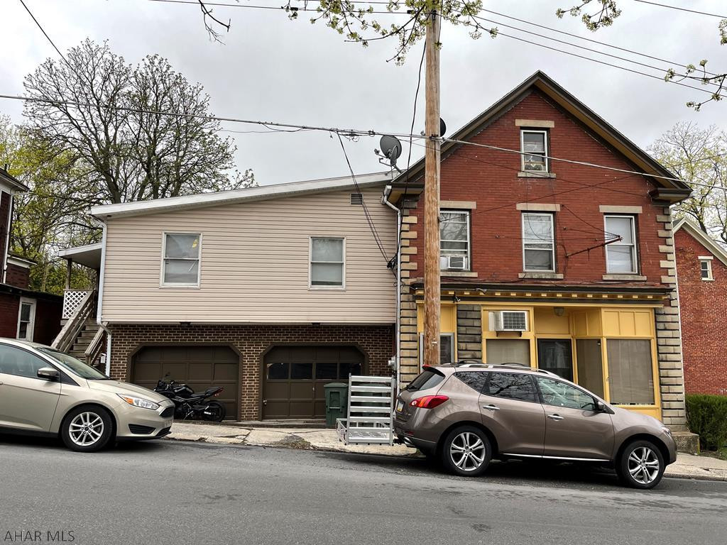 Attention Investors!! Fully Rented Triplex in Hollidaysburg. 2 car garage could be used for extra income. No yard to maintain. Heat and Electric is separate--Tenants pay. The water and sewer landlord pays. First apartment is all electric heat. The other two apartments are forced air/natural gas.