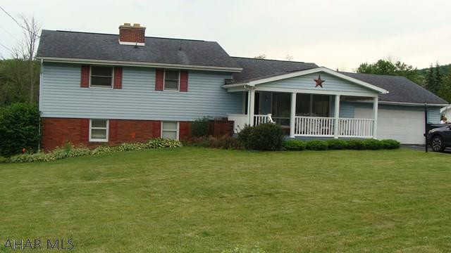 This custom built home sits on almost one acre with a large level back yard. Enter the home from the covered front porch and into the spacious living room. Enjoy the view from your eat in kitchen or from the deck that overlooks the backyard and includes a natural gas grill. This home features three spacious bedrooms with large closets and a nice sized bathroom with a walk in shower. The lower level offers a large space for your family to enjoy and a beautiful two sided brick fireplace. The lower level offers a large workshop, laundry room, powder room, and a bonus room that could be used as an office or play area. Easy access to the back yard through your two siding glass doors in the walkout basement. This home also has a two car attached garage and large driveway for off street parking.