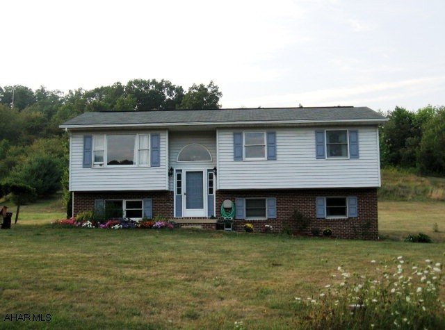 Many upgrades in this 3BR, 2BA on 4 acres with great mt. views. New appliances incl. a convection oven, remodeled bath w/jacuzzi tub, new flooring and new rear deck. Barn could also be used as a garage with room for 4 cars.