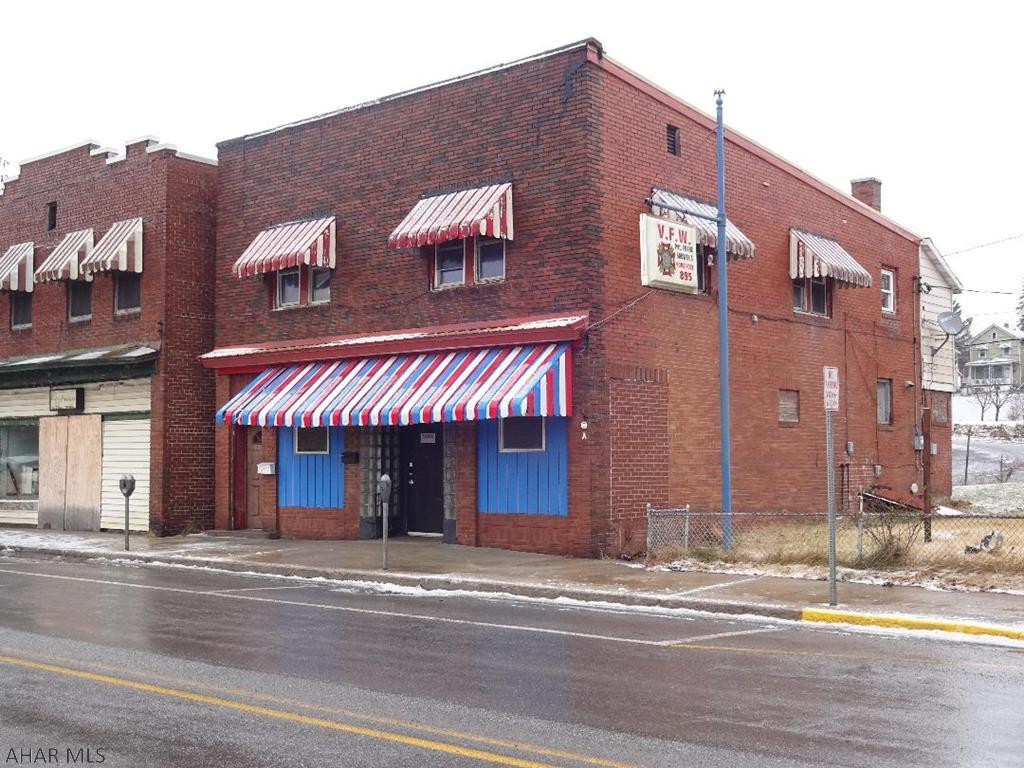 So many possibilities for this 2 story brick building. Could make a great business opportunity. 2nd floor apartment has 2 bedrooms. Being sold in "AS IS " condition