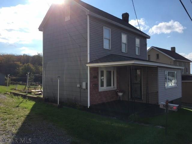 Very well maintained two bedroom home, nice lot, eat-in-kitchen, enclosed front porch, covered back porch, patio in back, & 2 sheds