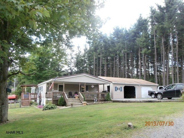 Lot size is approximate - seller having property surveyed and subdivided. Very clean and well maintained home with oversized 2 car garage. Nice country setting.