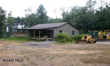 One story home that needs to be finished. Most all materials are on site to finish the property. This could be a really nice property w/ a little work. It is located in a nice country setting w/ a good view. Well and sound mound have been completed.
