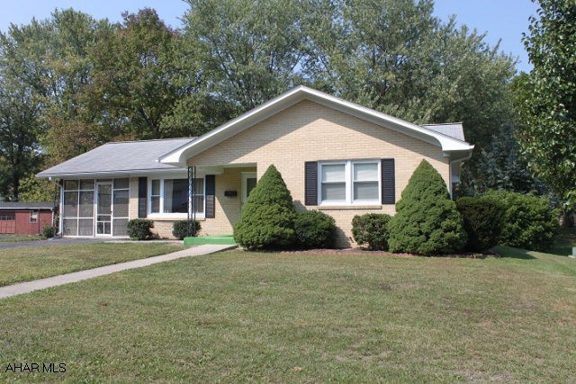 2 bedroom brick ranch in quiet neighborhood, prestine hard-wood flooring throughout the main floor with two large bedrooms that feature full-double closets in both.  Front-room living room is bright and comfortable with large newer windows throughout the house.  Main-floor and basement laundry hookups, an open floor-plan and extra bathroom in the  full basement.  15x9 shed has electric and lighting installed already.  Grass alley-way behind property provides great access for gardening and convenience.  Behind property is a wooded lot.