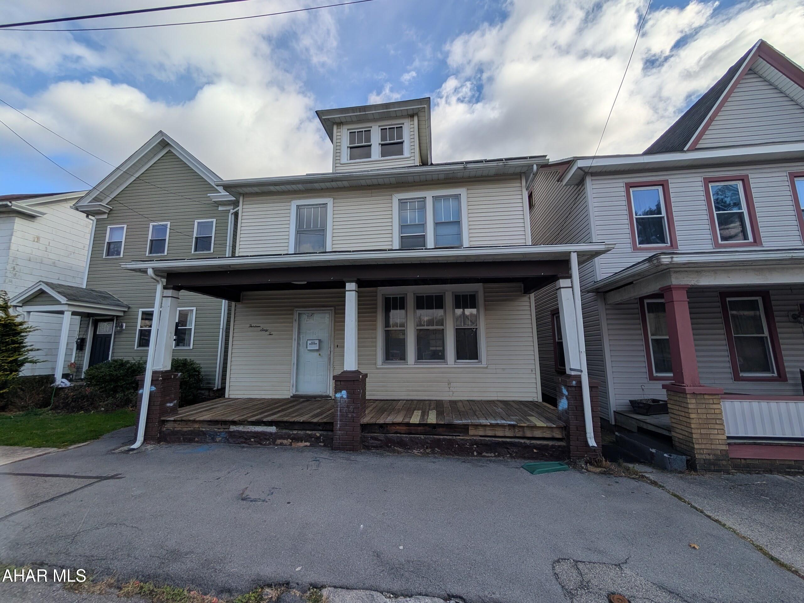 Tyrone Borough 2 story vinyl home is perfect for investors or handy persons.  Large formal living room, formal dining room and large eat-in kitchen (cabinets missing), Second floor has 3 bedrooms and 1 bath plus walk-up attic for storage. Nice' level back yard w/ rear alley for possible off-street parking (check w/ municipality).  AS-IS sale, seller will make no repairs.