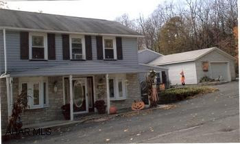 Lovely remodeled home WITH POSSIBLE MOTHER-IN-LAW SUITE,  two-car plus garage with workshop, extra large back yard. Living room has oak hardwood floor, built-in bookcases, propane fireplace. Skylights in breakfast room with sliders, possible master suite on first floor. Several decorative bay windows, oak kitchen cabinetry and ceramic flooring, walk-in closets, thermal glass windows, large laundry room, patio, deck.