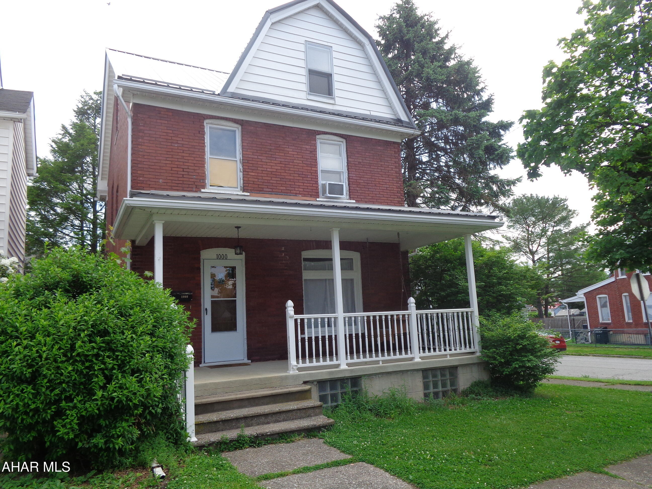 Attractive  brick home on a corner lot with a brand new metal roof installed (May, 2026).  Updated kitchen and bathrooms, hardwood floors and a 1st floor bathroom.  A  2 car detached  garage with a spacious  heated 2nd floor  loft area for storage.  The attic could be a 4th bedroom.   Currently approved for student housing.  Was recently appraised for $122,000.