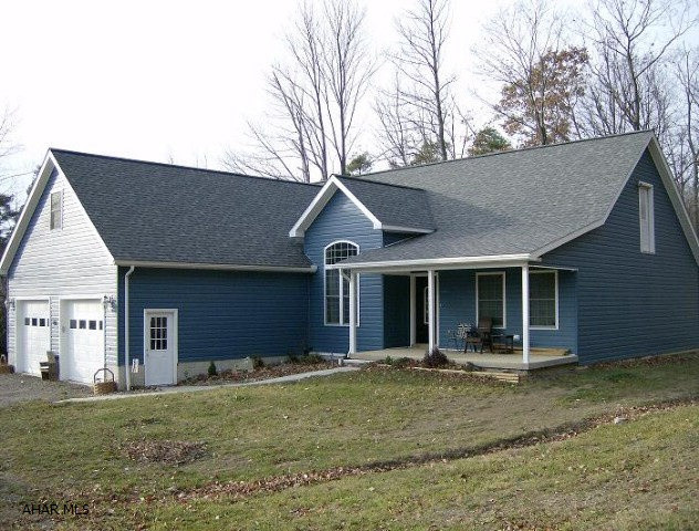Northern Cambria schools- 5 year old 3-4 BR vinyl sided Cape Cod on almost 1 acre. Partially finished basement with family room & bar. 2 car attached garage. Wood stove