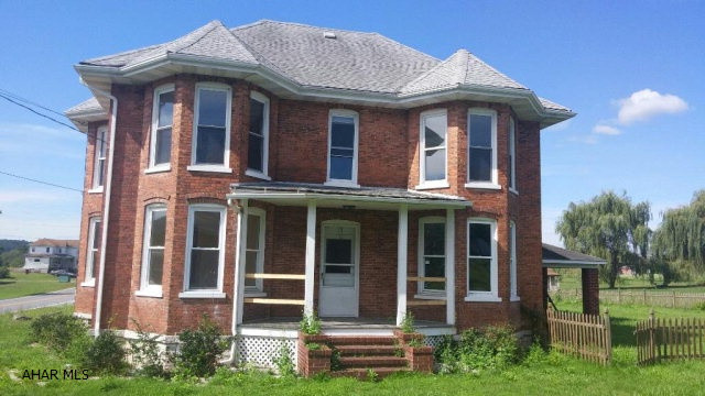 Brick Victorian ready for your TLC. Detached 2 car garage, covered pavilion and fencing. Close to I-99.