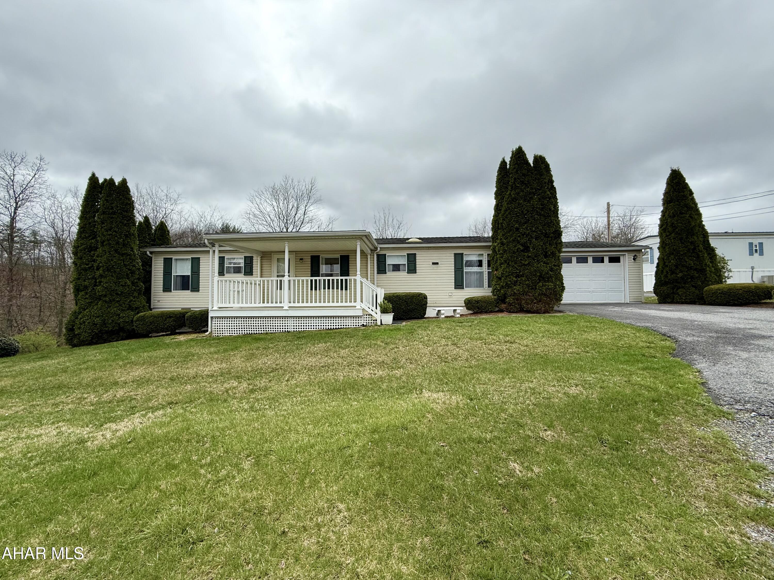 Right outside of town. Well, maintained home situated on a half acer lot. This property features an 17' x 22' attached garage, three spacious bedrooms, and two full bathrooms. The primary bedroom has a private bath and walk-in closet. Furnace recently serviced and plumbing inspected.  Flooring updated and new roof (30 year shingles) estimated in 2018/2019.