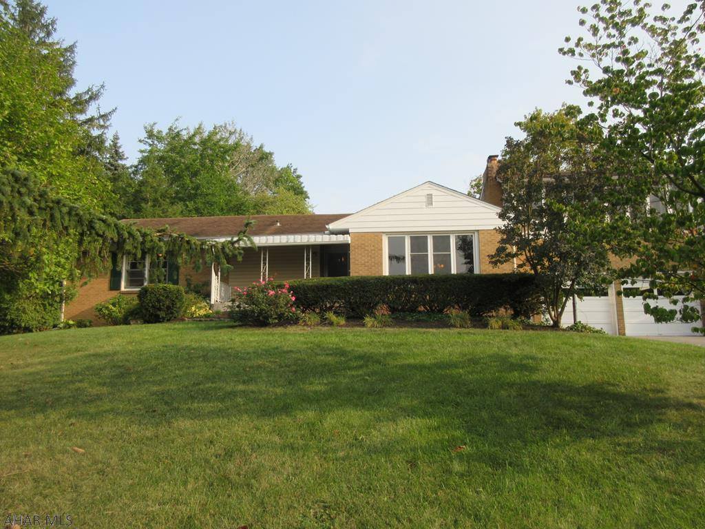 Fabulous brick & vinyl 1 story home on private 0.96 acre lot! Features large living room with brick fireplace, hardwood floors, open dining room, adjoining cherry kitchen with nesting center island and first floor laundry. 3 bedrooms and 2 baths on first floor including lovely master suite. Finished basement includes family room with wet bar and gas fireplace, kitchenette for entertaining, 1/2 bath plus storage area. Over sized attached 2 car garage with large workshop area with spacious atrium/sun room loft above with hot tub. Private back yard with large patio and above ground pool, plus deck off of atrium/sun room for plenty of entertainment options your guests will enjoy. You must see to appreciate the overall size and privacy this home offers.