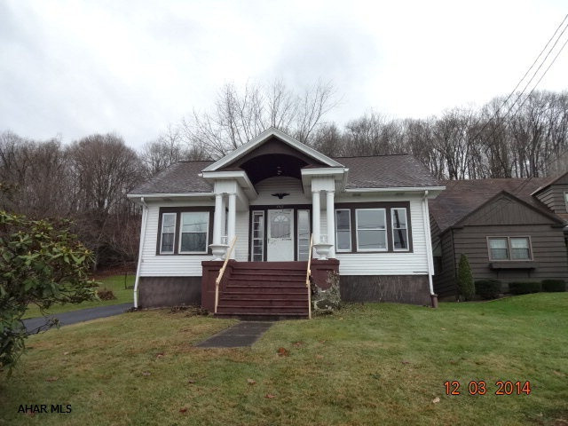 Adorable Cape Cod Saxton home on nice lot. Nice hardwood floors, vinyl siding, 1 car detached garage, covered rear patio. Being sold AS-IS. Seller will make no repairs.