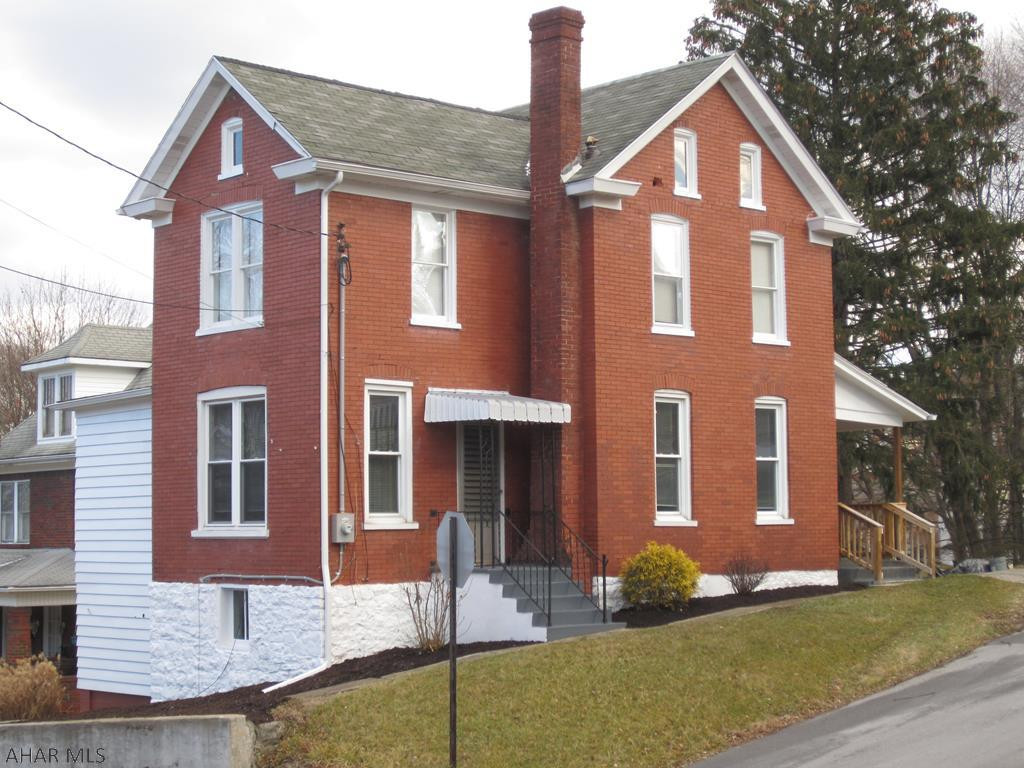 A very nice and clean 2 story brick home on corner lot.  This 2 bedroom, with bonus room, 1 bath would be a great starter home. The rooms are nice size with lots of natural light. It has public water and public sewer. The hot water boiler is fueled by natural gas.  The basement is unfinished but nice and clean. Fairly new furnace and hot water heater and the 200 amp panel box was installed late last year. This property is priced to sell. All taxes, sq. footage and land quantities are estimated. Buyer to verify amounts.