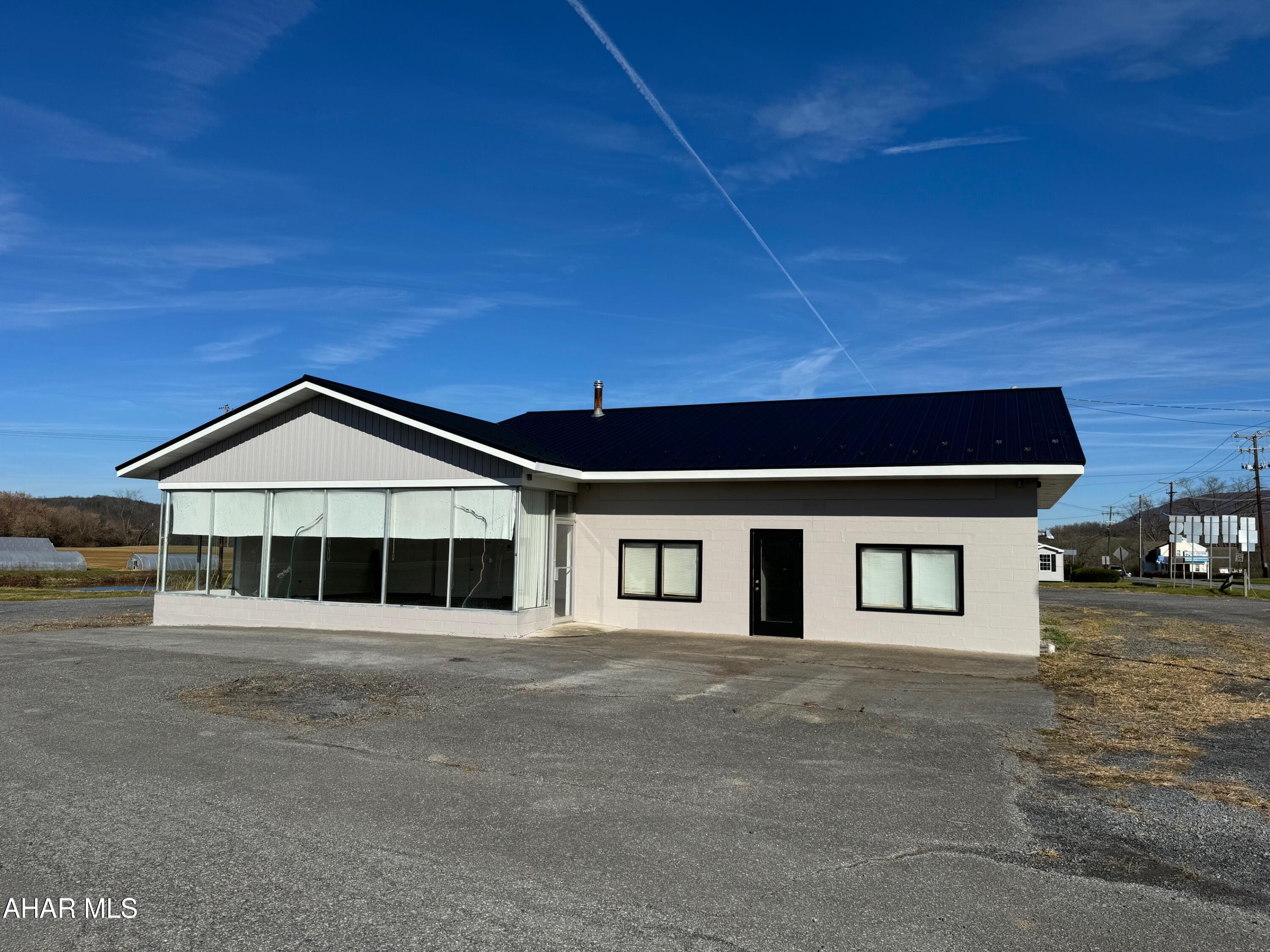 PRIME commercial location for lease along Route 220, Route 56 and Interstate 99!! Excellent visibility and exposure with this corner lot property and high traffic counts. Current building on site and one-acre can be leased for a base price $2,500 per month plus utilities as-is. Owner willing to do a remodel or build-to-suit for qualified tenant and lease terms (price subject to change). Property can be retail, professional office, medical, light manufacturing, large storage facility, truck stop, c-store, or many other possibilities. LARGE lot consisting of 29.19 acres with NO ZONING. Can be divided for multiple tenants. Central location in the heart of Bedford County with easy access to major roads and the PA turnpike interchange.