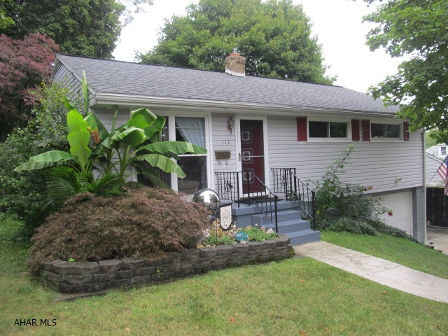 WOW! This impeccable one story home is just filled with all the desired attributes that almost everyone is looking for these days.        Location! Privacy! Modern! Spacious!   This charmer has a custom built gas fireplace in the completely finished family room in the lower level, In the main level, it has beautiful hardwood floors throughout, ceramic tile in its very modern oak kitchen & bath, central a/c, and... one of my favorite parts of this house is the setting!  This is the most unique part of this home.  Get this..it sets right across the street from one of the most desirable elementary schools (Baker), yet it has the most amazing private rear setting with this astounding rear deck!  This is why I say WOW!  In this price range ...dare to compare!