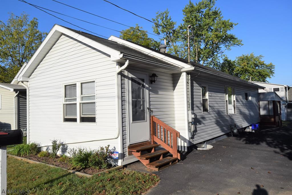 Move in condition.  So much bigger than it looks from the street!  Home has fresh paint, nice floor coverings, large walk-in closets.  Screened porch in rear.  Pantry in kitchen could be converted to accommodate stackable washer/dryer for total one floor living.   Screened porch in rear.  Plenty of off street parking.  One bedroom apt above garage would be a great man-cave or designated hobby area.  Walking distance to YMCA and schools.  Quiet neighborhood.
