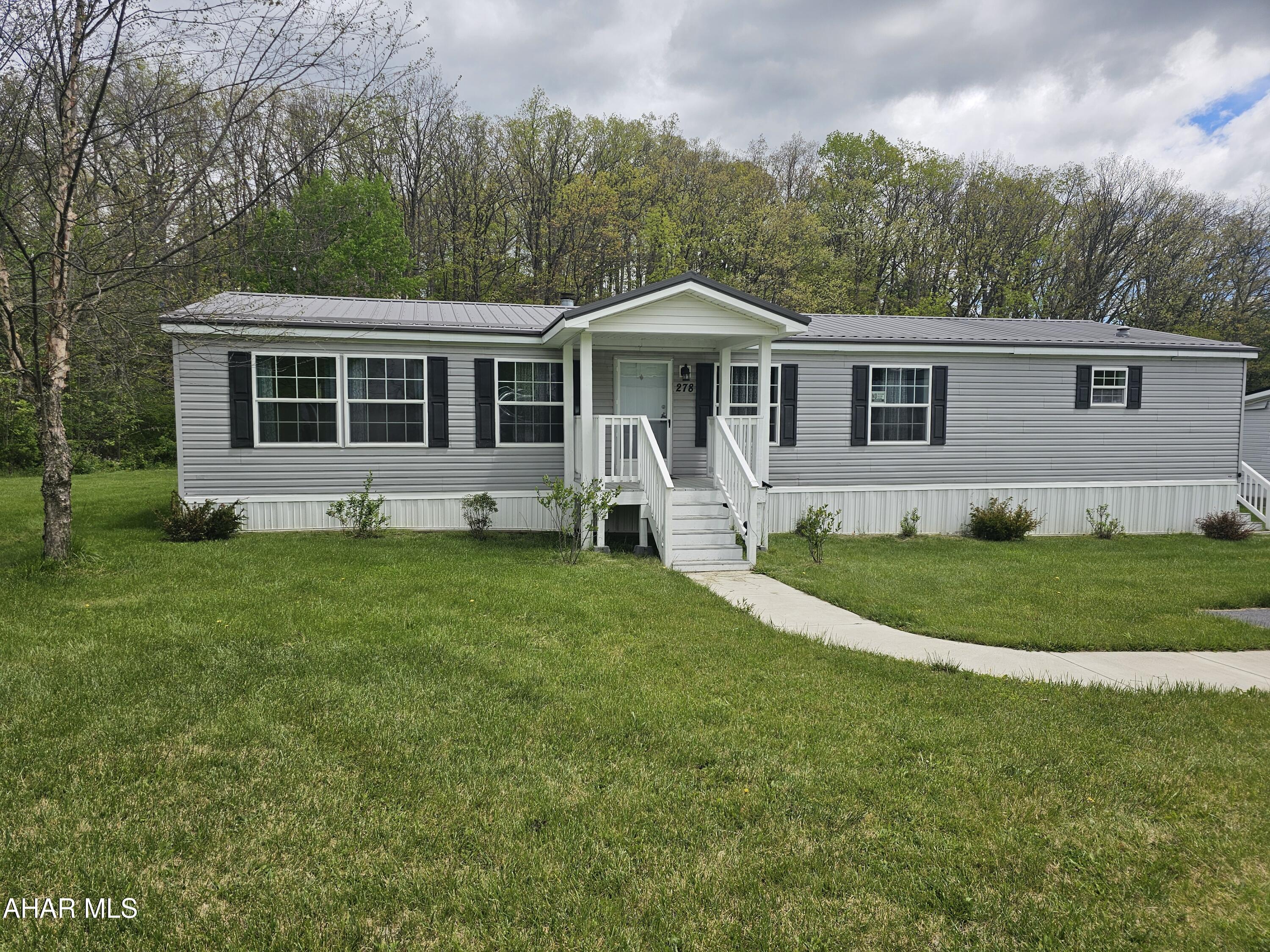 Wow this mobile home is gorgeous, why look any further, 278 Cambridge Dr. It  sits on the biggest lot in Willowbrook Community.  If you have a family and want a big yard come make this your home on a  corner lot. The deck and porches will be great for all your out door entertaining this summer. Step inside to a beautiful open floor plan, the living room has a wood burning fire place. A to die for kitchen that any cook would enjoy. The master bath is amazing with a soaking tub and walk in shower. 
Call me today to come tour this one before its gone.
You must fill out an application with the Willowbrook Community ( application is non refundable)