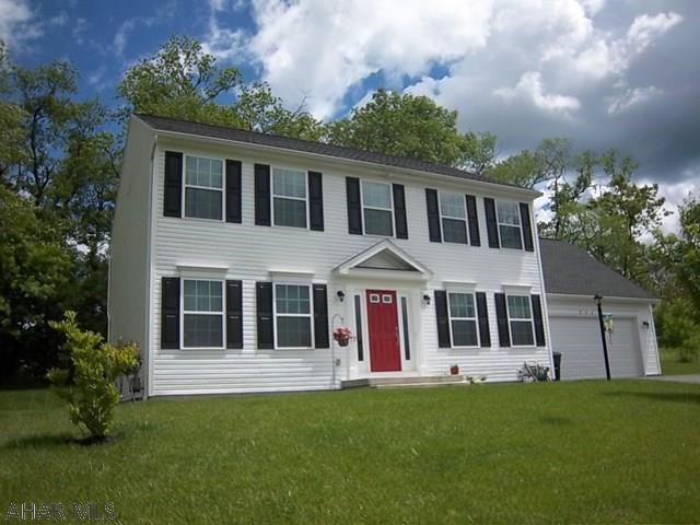 Rolling Hills North. This 4 bedroom, 2.5 bath home features a spacious kitchen w/granite counters, island, ss. appli. & tile floor. Dining rm w/hardwood floors. Living rm & family rm have bamboo floors & a pocket door between the rooms. 2nd floor master bedroom has a 7x21 walk in closet. Master bath has tile floor, double sink & new glass shower with tile surround,  granite & garden tub.Three additional bedrooms, full bath & a convenient 2nd floor laundry.  Large basement could easily be finished. Access from the kitchen to a private, wooded backyard with patio pavers creates a perfect place to relax & entertain. Attached two car garage completes this ready to move in home. This is an S&A home with many upgrades.