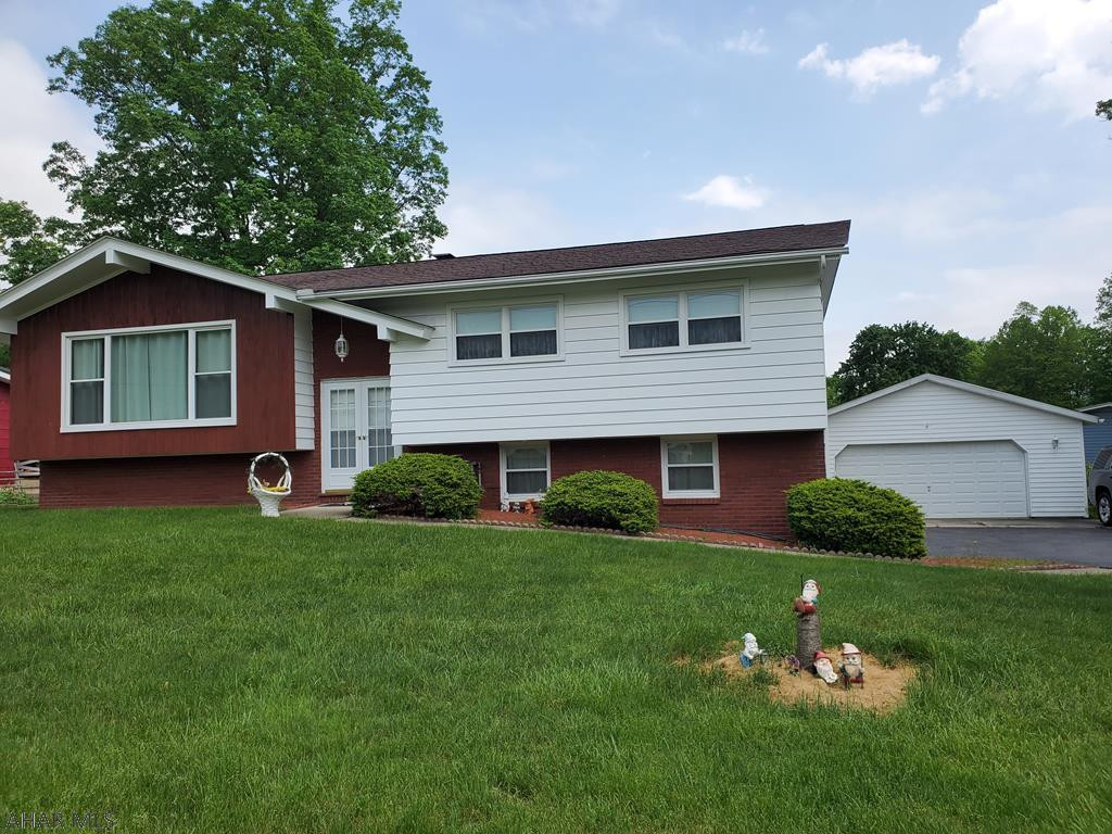 Nicely maintained Bi-level. Spacious living room and bonus family room. 3 bedrooms, 1 full, 1-3/4 bath and 1-1/2 bath. 4 car garage, storage shed, huge lot.  Gas hot water heat and central air, public utilities