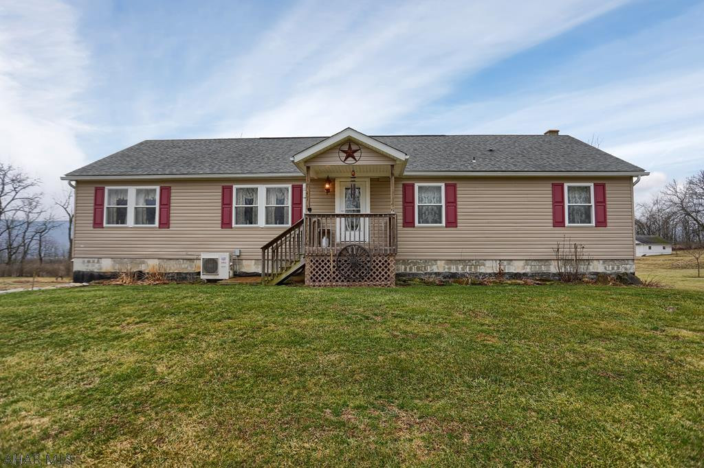 Don't miss this peaceful oasis in the heart of Sinking Valley. This 3 bedroom, 2 bath house has stunning hardwood floor throughout, Amish built cabinets and counter tops, and a relaxing 3 seasons room. Master bedroom with an attached full bath. Large 2 car garage. Spacious basement with wood burner. Very large yard. Front porch and back deck where you can enjoy the beautiful country scenery.